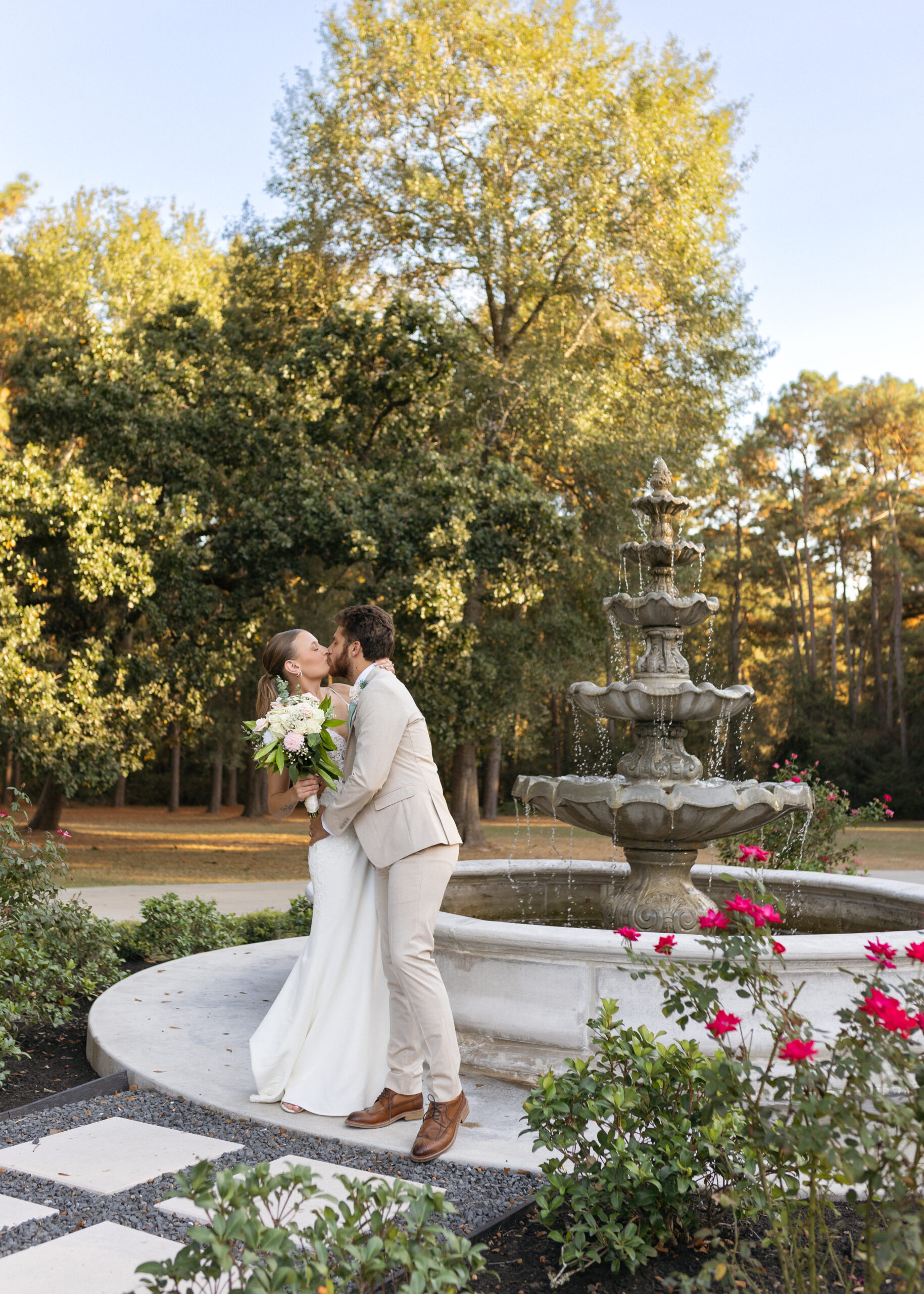 The-Annex-Wedding-Pricing-and-Packages-1 Couple kissing in front of fountain at The Annex wedding venue